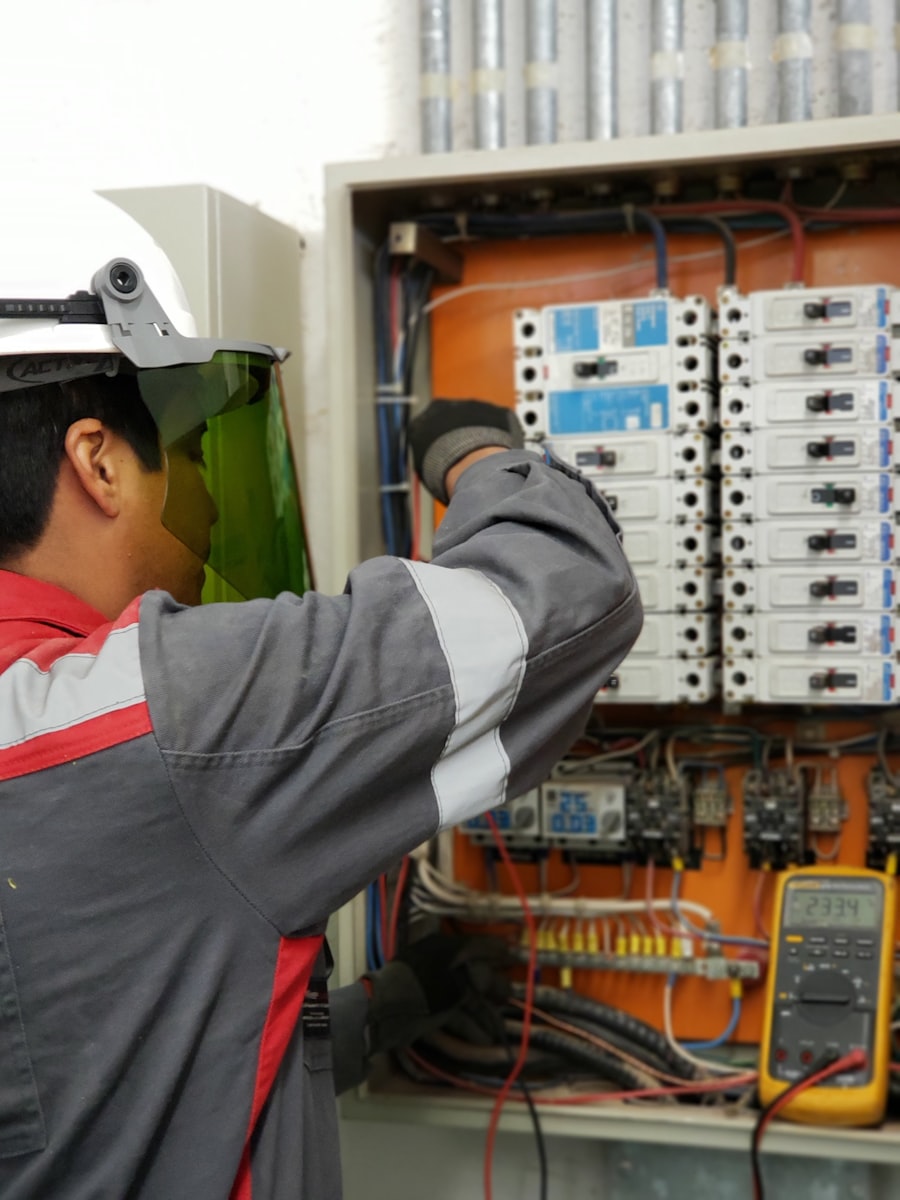 Electrician working on electrical panel